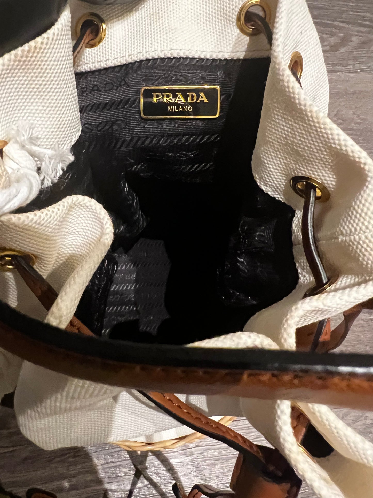 Prada small logo plaque wicker bucket bag